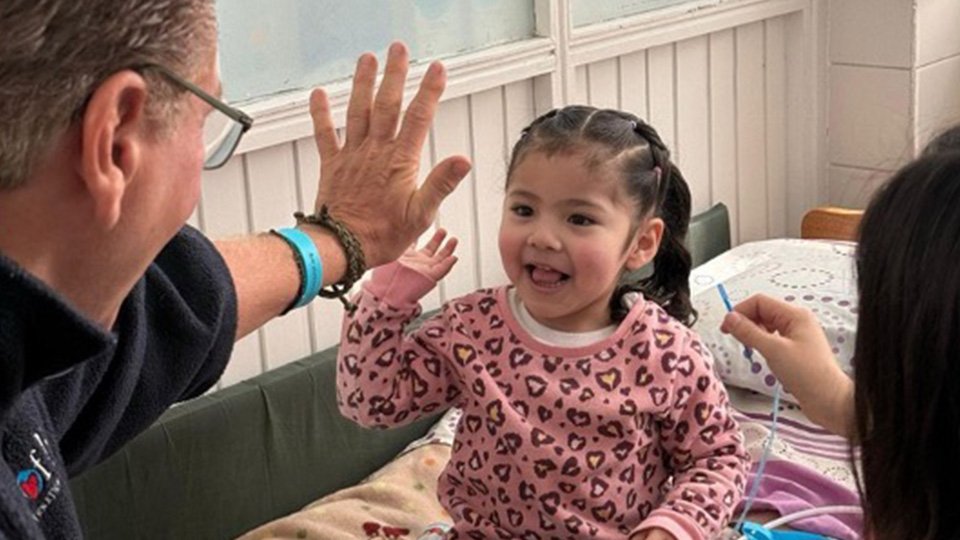 Gift of Life International Girl Giving High Five